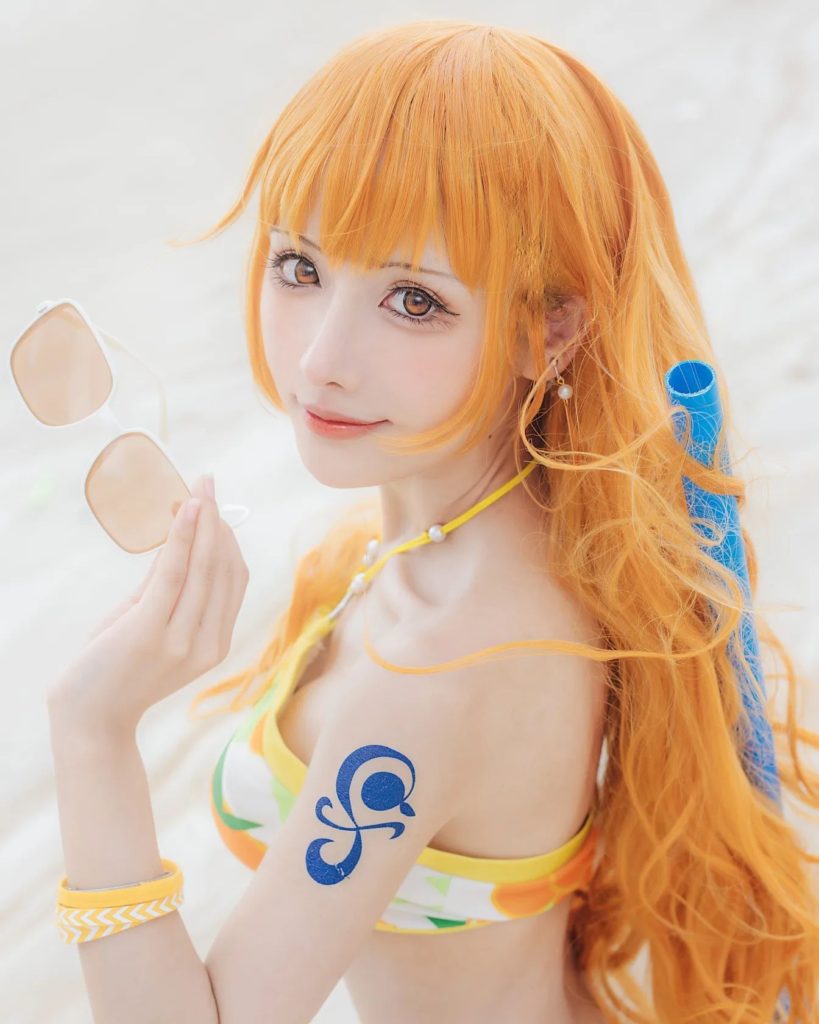 คอสเพลย์ Nami จาก ONE PIECE ในชุดส้มสดใส 3 คอสเพลย์ Nami จาก ONE PIECE ในชุดส้มสดใส