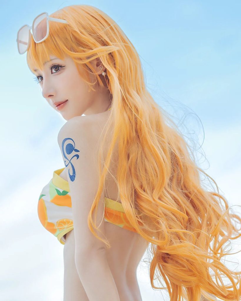 คอสเพลย์ Nami จาก ONE PIECE ในชุดส้มสดใส 2 คอสเพลย์ Nami จาก ONE PIECE ในชุดส้มสดใส